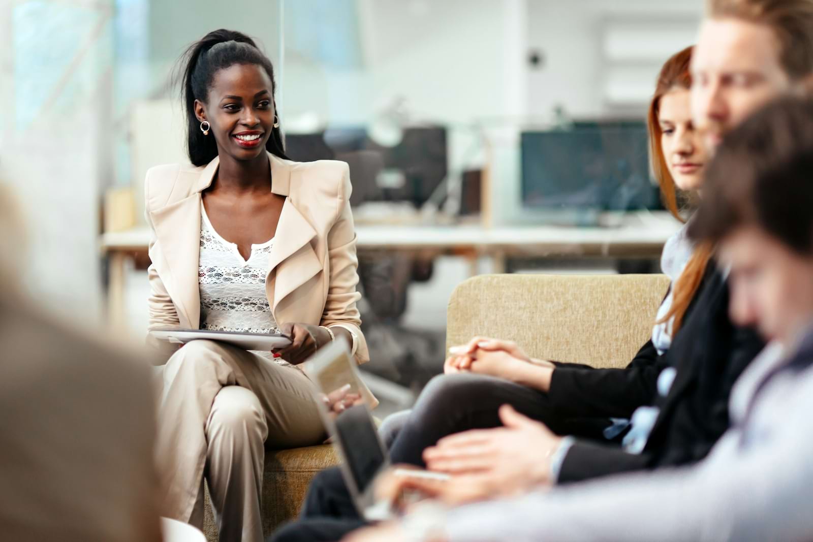 Image of a group of professional people sitting and talking together 